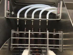 Máy Rửa và Chiết Rót Chai Tự Động 4 Vòi Bơm Nhu Động